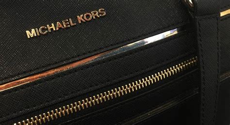 michael kors profit forecast